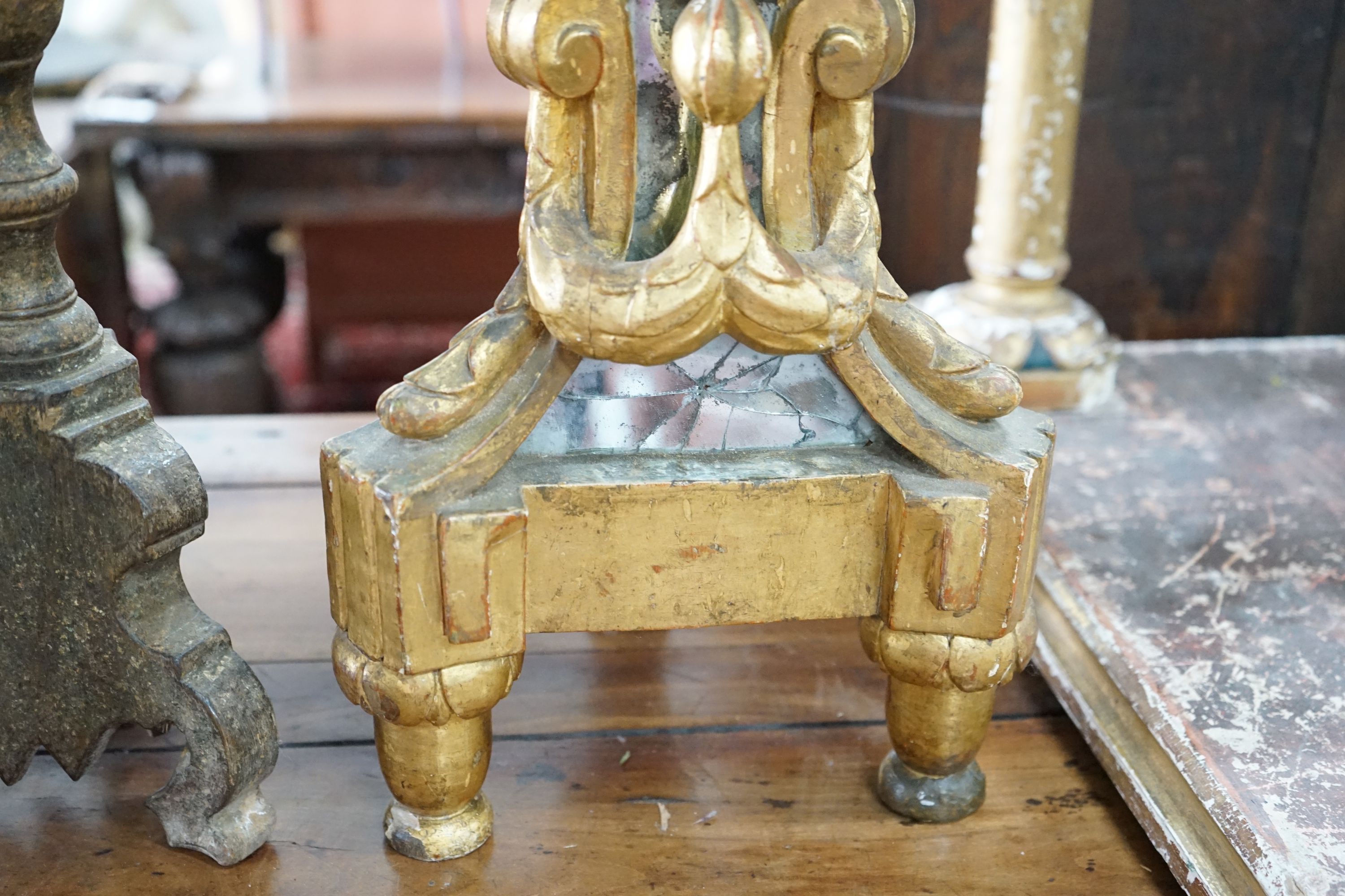 Two 18th century style Italian giltwood altar sticks, larger height 82cm